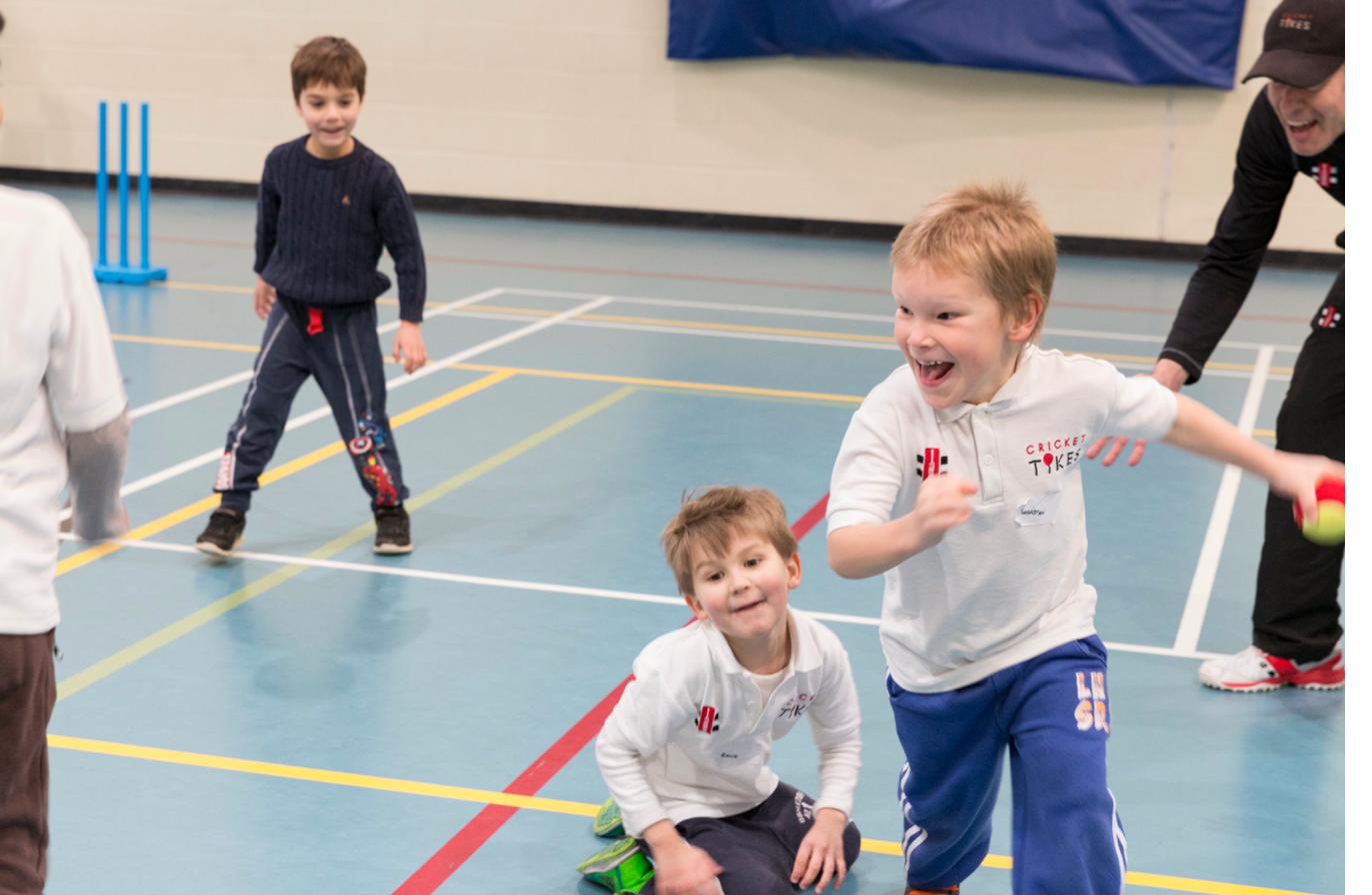 Children celebrating during a Cricket Tikes session