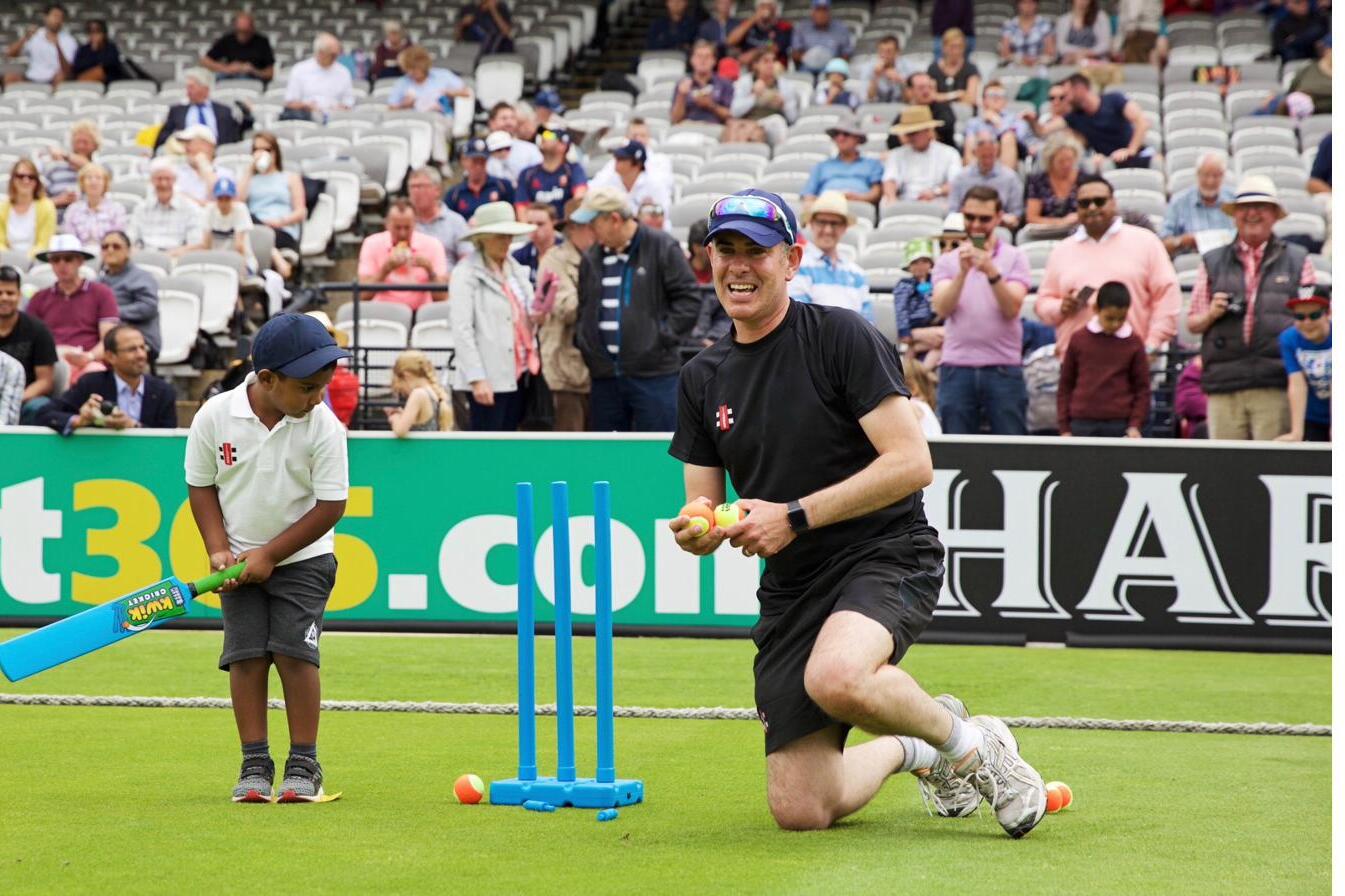 Jason Moore coaching on the Lord's outfield
