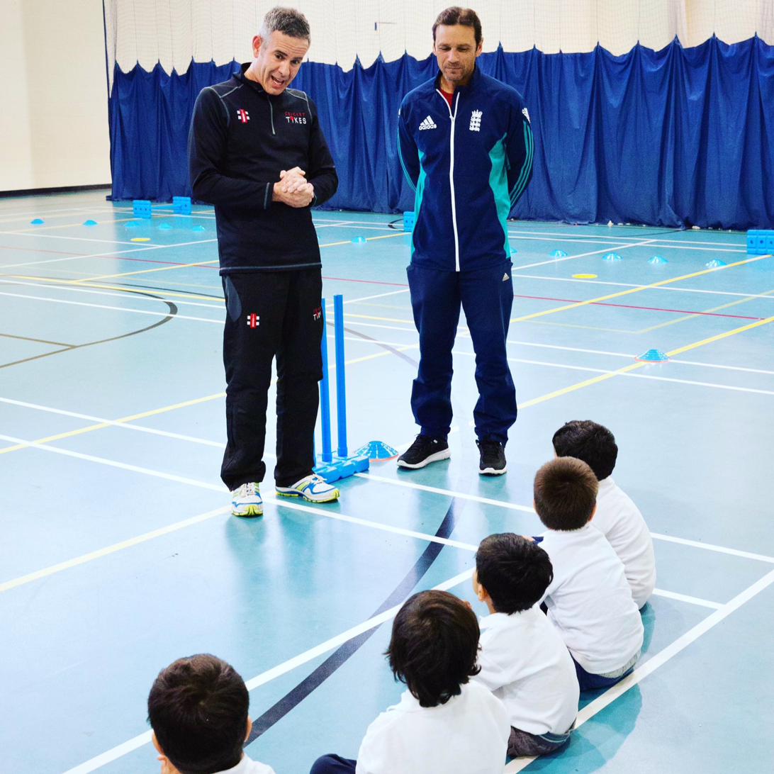 Jason and Mark Ramprakash coaching children